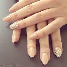 Such design is very popular among the officers. Beige Nail Art With Diamonds Design
