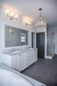 The bathroom itself will use marble subway in the shower, marble hex around the walls and a 24'x12' dark gray tile on the floor. White Ensuite Grey Marble Bath Surround And Countertops Double Vanity Polished Nickel Fixtures Grey Bathroom Floor Grey Bathroom Tiles Dark Gray Bathroom