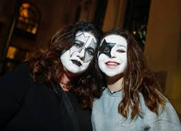 kiss fans wearing makeup honor their