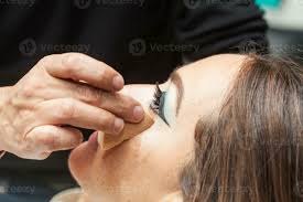 makeup artist applying foundation using