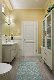 gray floor bathroom with yellow walls