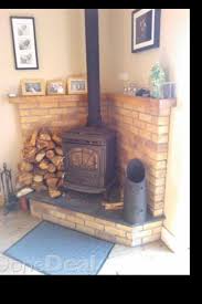 Update your pellet stove by giving it some board and batten and a little mantle. Corner Stove Wood Burning Stove Corner Wood Stove Hearth Brick Hearth