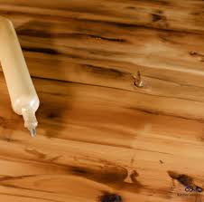 remove rubbing alcohol stains from wood