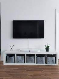 what to put under the tv on the wall