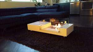 Merges Fireplace And Coffee Table
