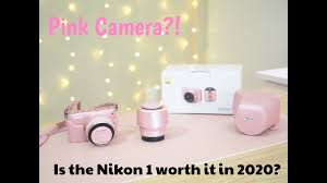 pink nikon 1 mirrorless camera
