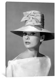 audrey hepburn in a tall two bowed hat