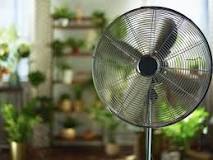How should I set my fan to cool my house?