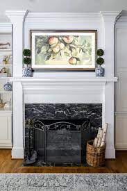 decorating a mantel with a tv above