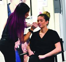 cosmetology students learn tips and