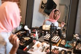 emale vlogger in pink hijab doing a