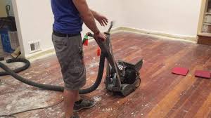 refinishing floors with a drum sander