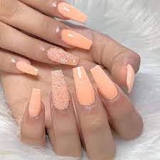 Furthermore, the combination of white and peach is great for making a sober statement. Coffin Nails Peach Acrylic Nails Orange Nail Polish Orange Nails