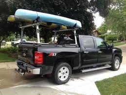 This kayak rack works using the existing stake pockets and as long as the tonneau cover doesn't cover them up you can. Kayak Don T Fit The Truck Bed 3 Solutions