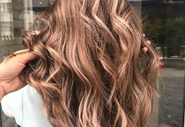 Golden brown highlights pop against a darker base tone. 38 Best Light Brown Hair Color Ideas According To Colorists