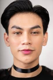 asian man with a pretty face wearing