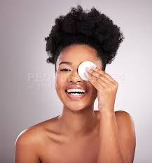black woman skincare and cotton on eye