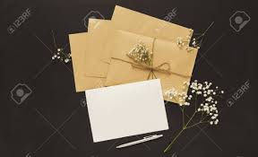 Wedding Invitations And Craft Envelopes On Black Background