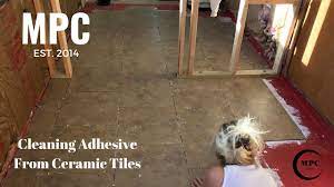 cleaning adhesive from ceramic tiles