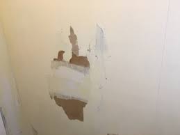 wallpaper and damaged drywall