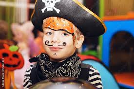 little boy in a pirate costume and a