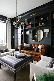 Black and white rugs, art, pillows, and other decorative accents keep the integrity of the black and white living room style, but in a way that's much warmer. 28 Gorgeous Living Rooms With Black Walls That Create Cozy Drama