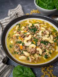 macaroni soup with herbs and spinach