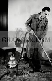 vacuum cleaner 1950s a man cleaning