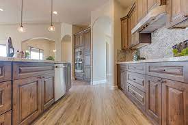 Note the island lighting hanging from a wire. Tahoe Ash Kitchen Cabinets From Value Series Wood Cabinets Custom Kitchen Cabinets Kitchen