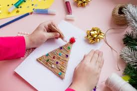 Start designing with the crello christmas card creator. Premium Photo Girl Making Christmas Cards And Decorations For Family And Christmas Tree Celebrations Birthday Party Presents