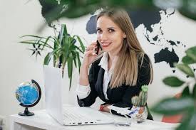 happy businesswoman travel agent using