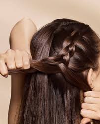 Braided hair that hangs from a point on the back of one's head, much like a ponytail. How To Style A Braided Ponytail In 3 Steps Wella