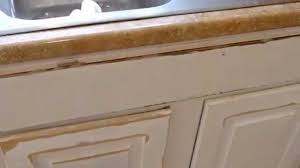 Paint from the top of the door to the bottom, so that you can correct any drips. Repairing Damaged Mdf Cabinet Doors Laminate Kitchen Cabinets Stained Kitchen Cabinets Mdf Cabinets