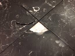 black marble floor tile with broken