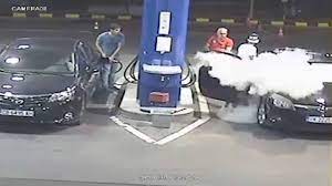 man extinguishes smoker at gas station
