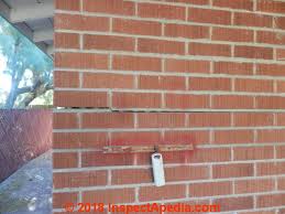 Minor cracks in drywall or plaster. Cracked Brick Wall Damage Assessment