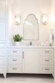 bathroom with arched mirrors