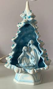 blue ceramic tree with nativity scene