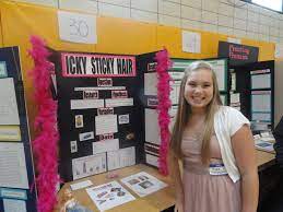 students show off science fair projects