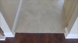 between tile and laminate floor