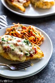 Juicy chicken, baked with a simple pasta sauce and cheese straight from the oven is really the best kind of meal. Oven Baked Chicken Parmesan