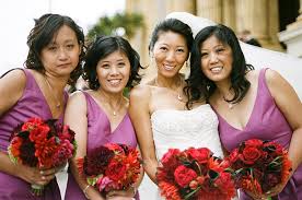 bride with bridesmaids in lavender red