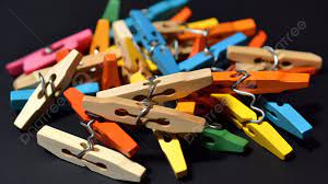 pile of colorful pegs on a black