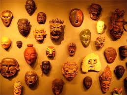 A wall of masks is featured in the booth of the Thomas Murray Gallery of Mill - A_wall_of_masks_is_featured_at_the_Thomas_Murray__Mill_Valley__Gallery