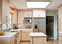 Kitchen with microwave cabinet open. How A Microwave Shelf Can Improve Your Overall Kitchen Experience