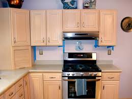 spray painting kitchen cabinets with