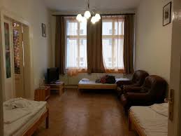 The windowsills are wide and there are some house plants on them. Big Living Room With 3 Single Beds Wooden Flooring Big Windows Picture Of Prague City Tripadvisor