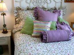 arranging pillows on a bed