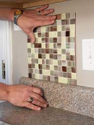 Simply place a tile where it should be held slightly off the wall. How To Install A Backsplash How Tos Diy
