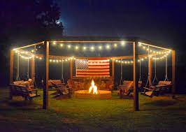 After you've built your firepit, consider adding some other diy projects like a shed, swing set, playhouse, and even a tree house. This Diy Backyard Pergola With Swings Is The Perfect Piece To Surround Your Fire Pit